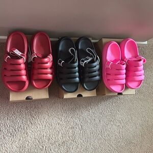UGG sandals Sz 7 black, pink and red. (red ones are NWT) black, pink are used.
